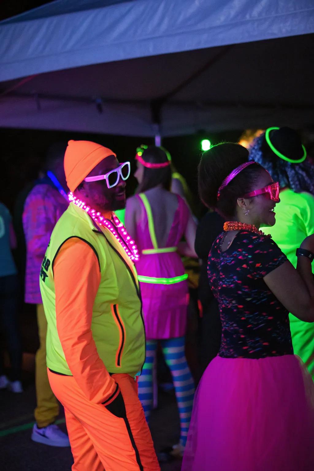 Attendees clad in neon costumes and trinkets, shimmering and lending verve to the celebration.