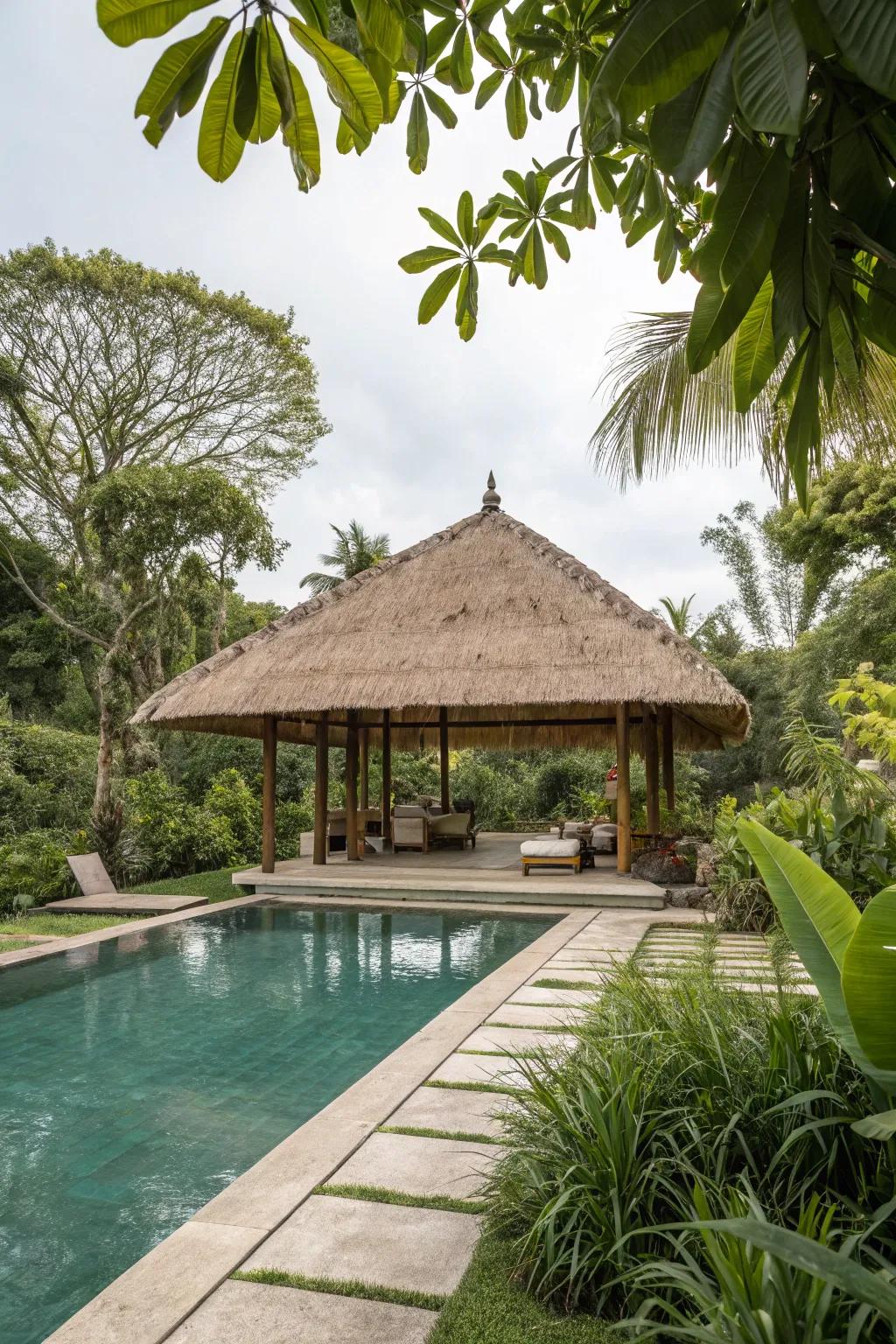 A thatched roof shelter conjures a tropical getaway within your backyard.
