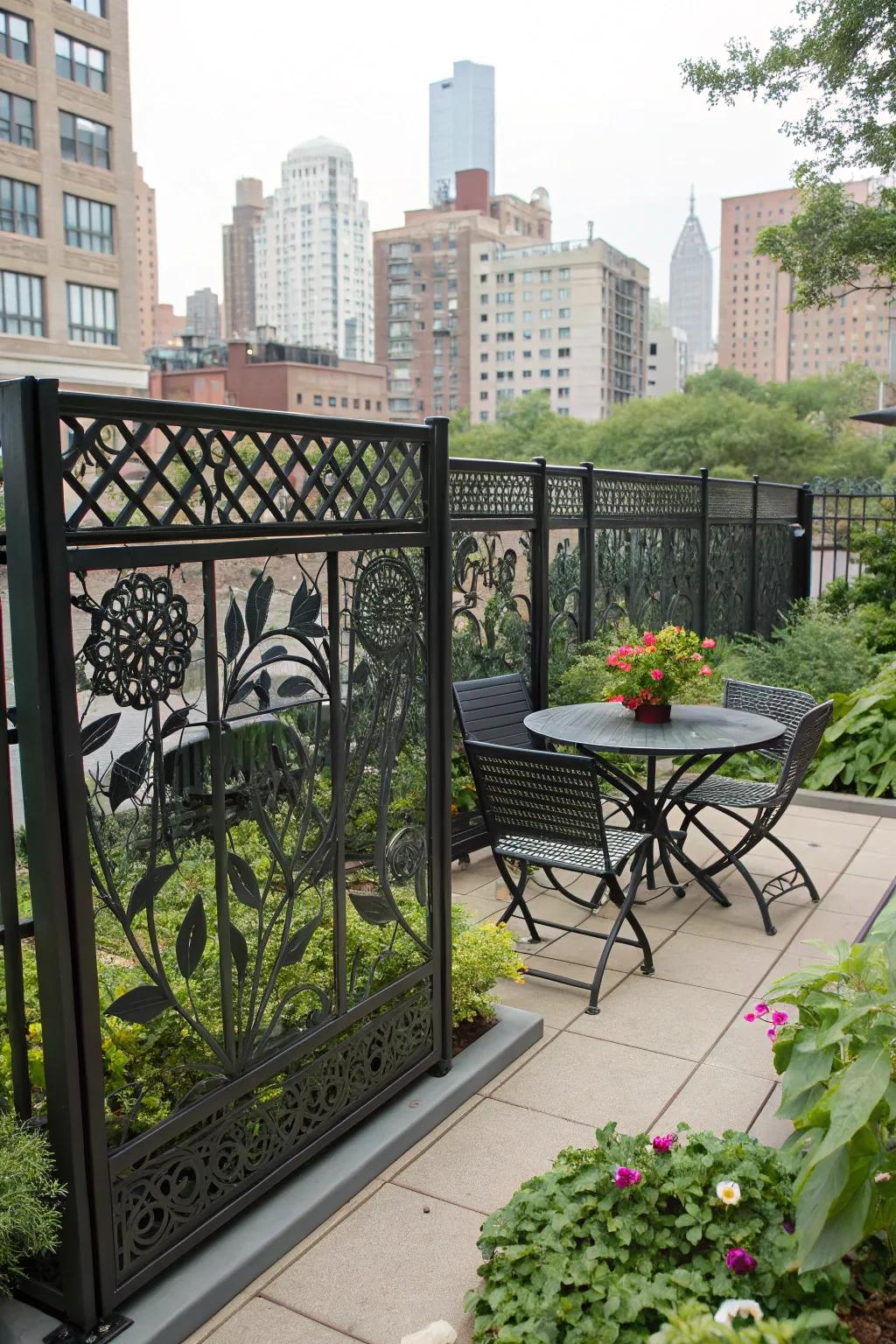 Artistic cutouts on a metal fence introduce a distinctive element to this urban garden.