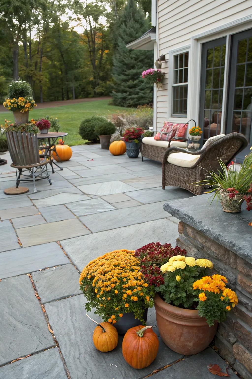A slate patio adorned with charming seasonal decor.