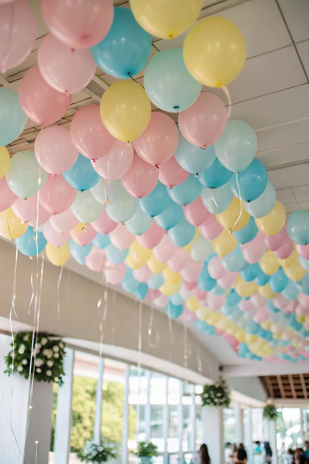 A dreamlike pastel balloon canopy transforming an ordinary ceiling