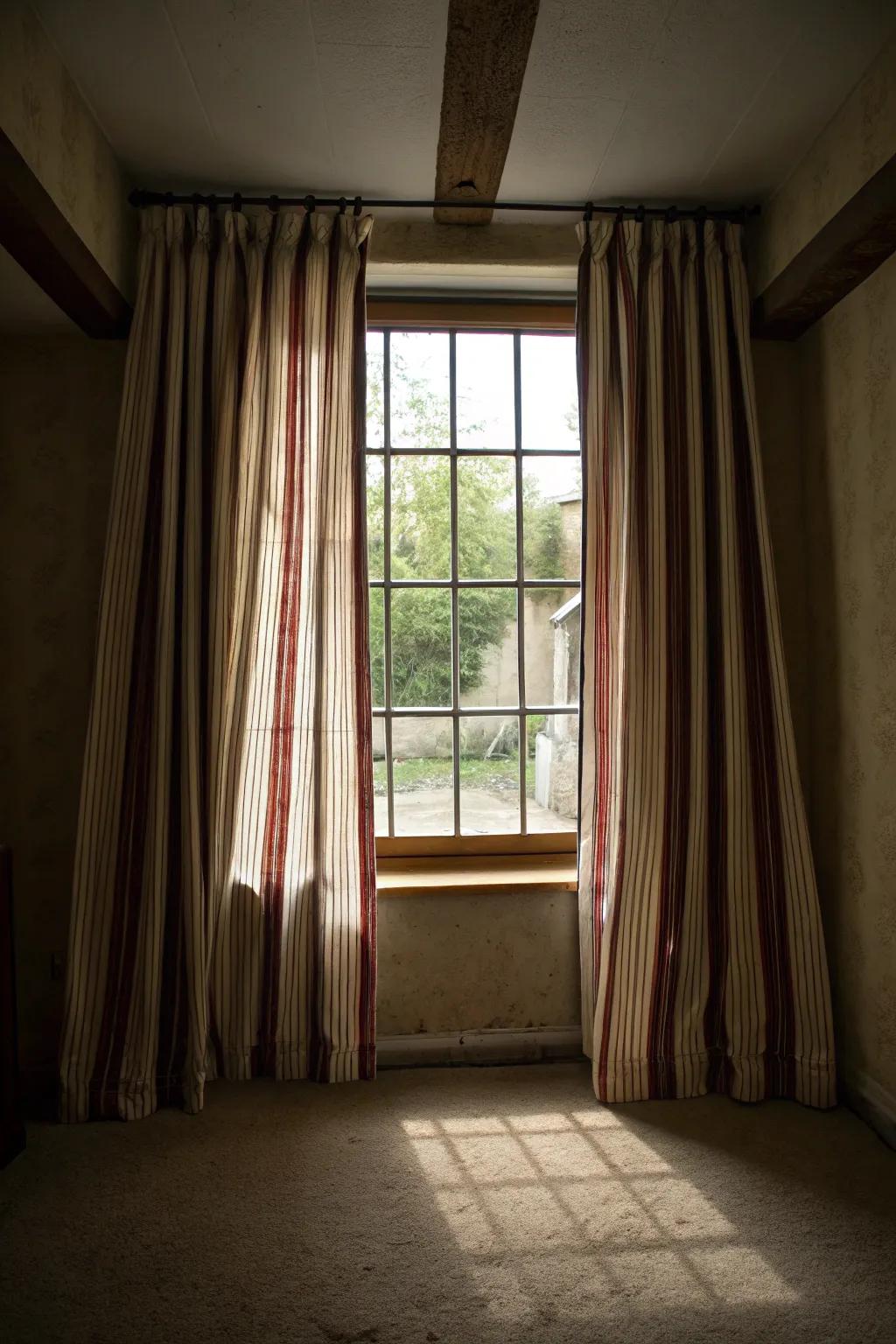 Striped drapes can visually amplify the space.