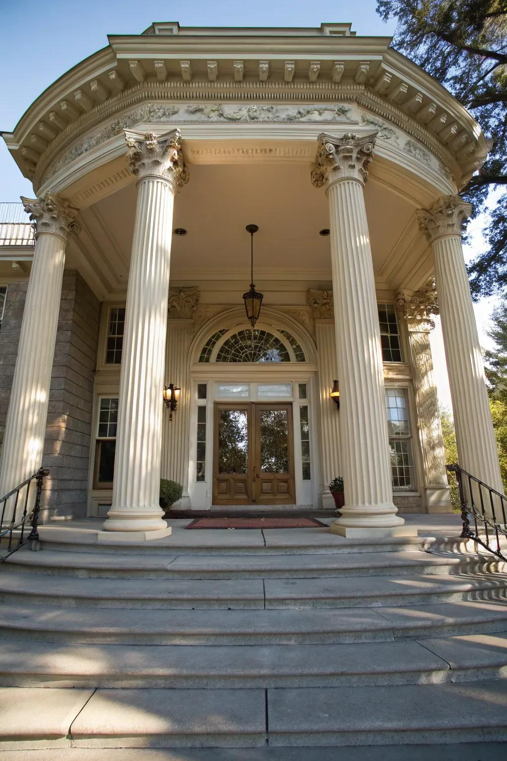 An elegant portico infuses grandeur to the entryway.