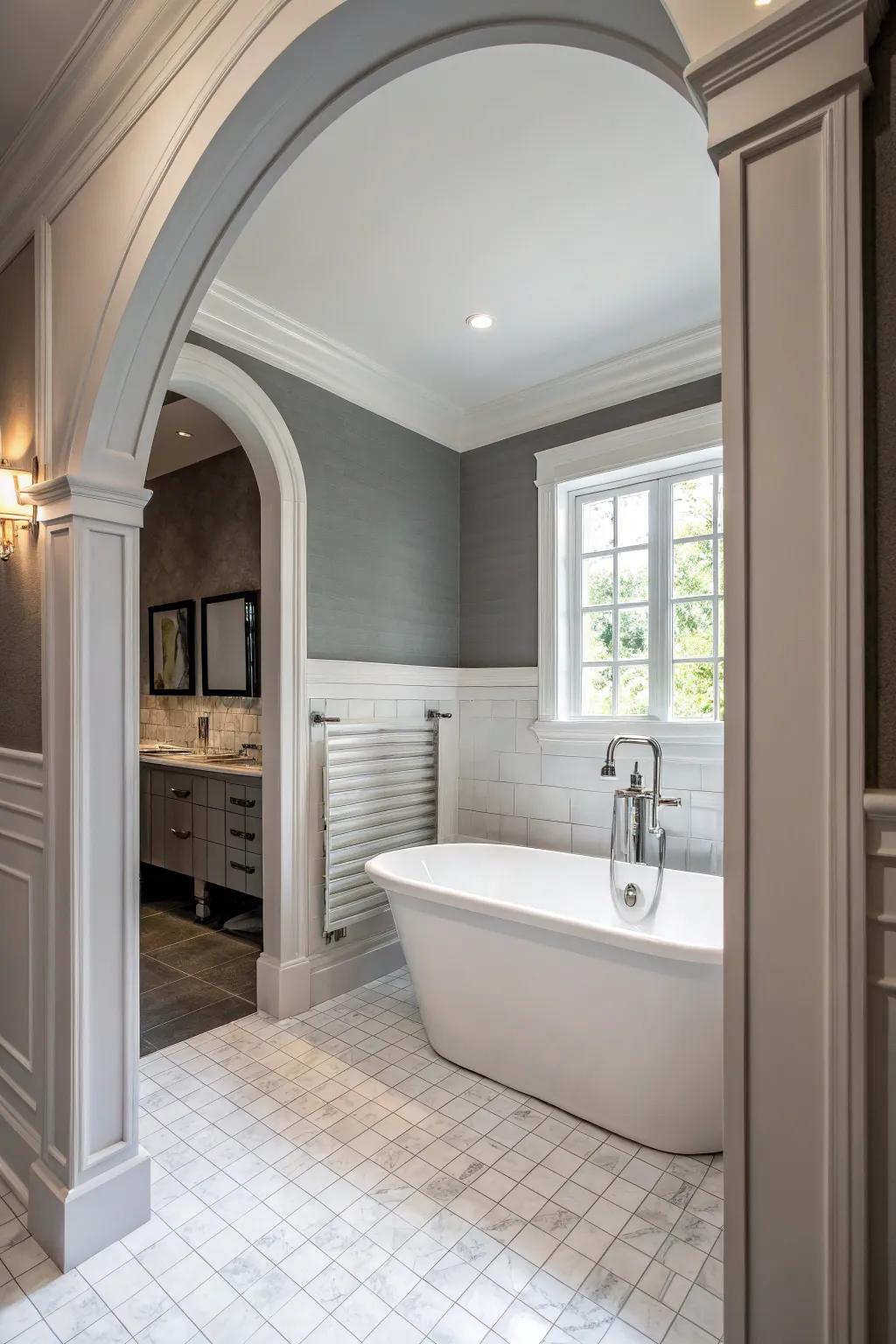 Grey partitions with alabaster components institute a classical and harmonious lavatory blueprint.