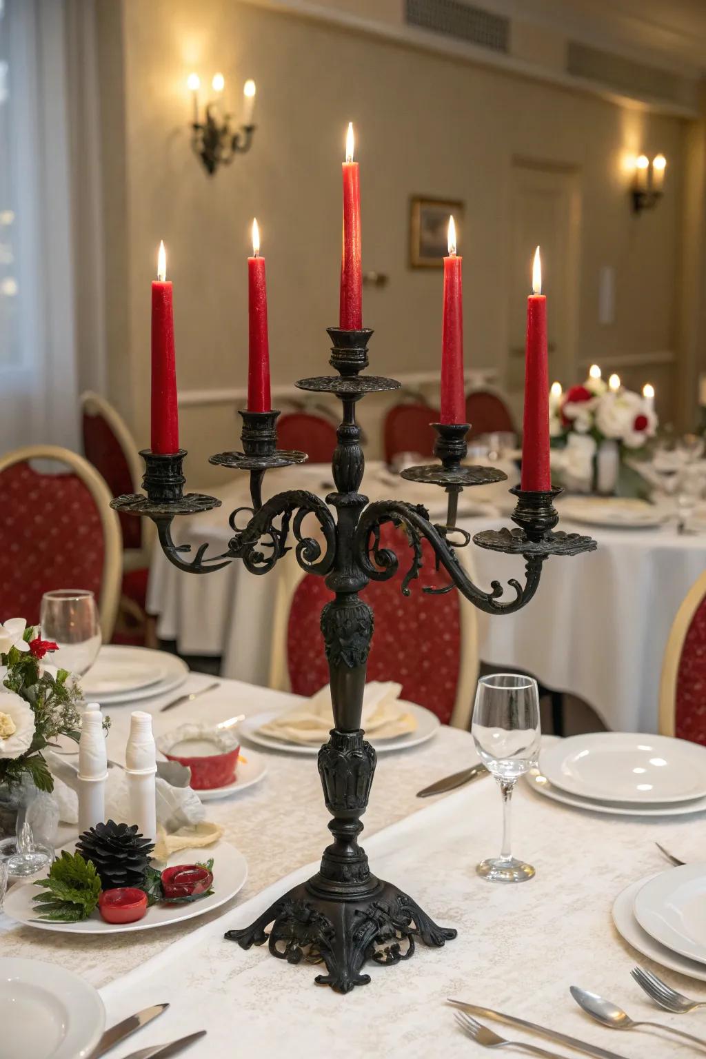 An official dining setting presenting a dark branched candleholder and scarlet taper sticks.
