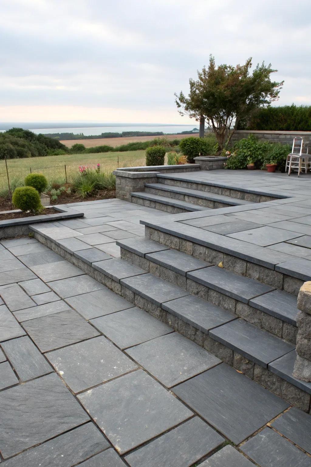 A multi-level slate patio with distinct areas.