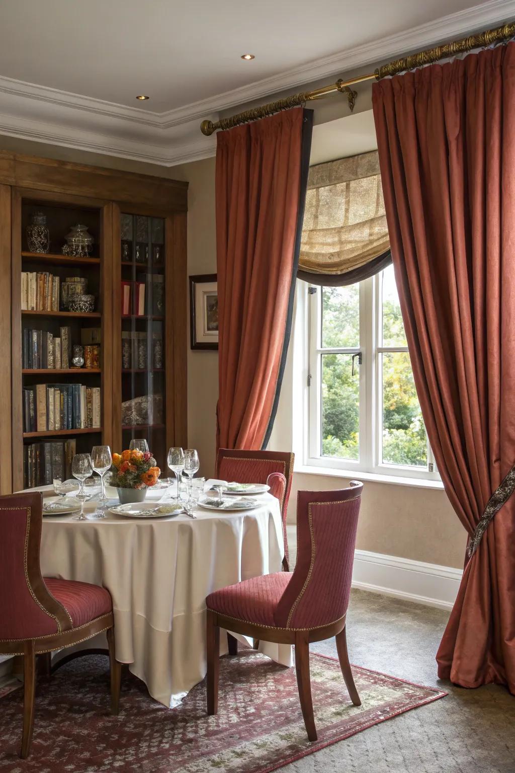 Luxurious drapery imbues drama and elegance into a small dining space.