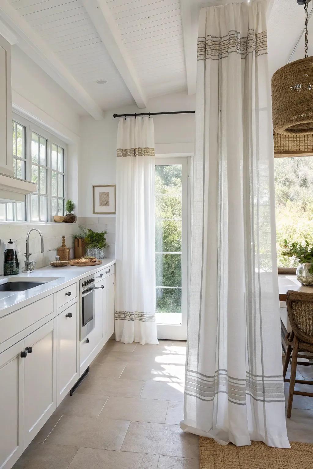 Subtle stripes upon alabaster draperies engender a pristine, contemporary visage within this cookhouse.