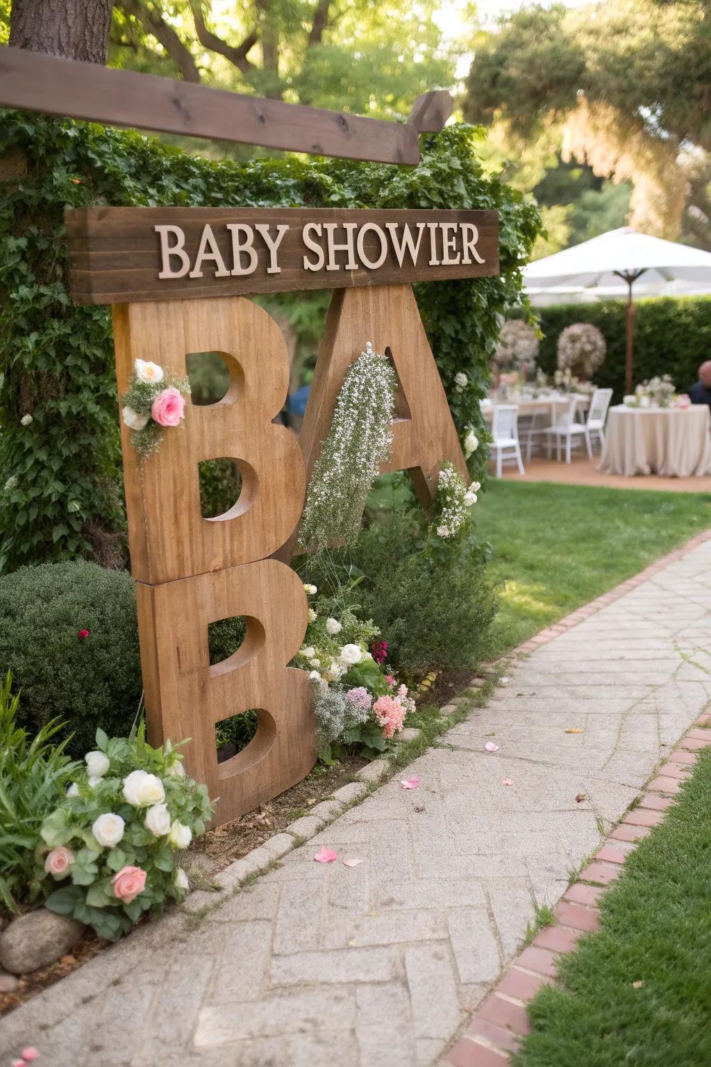 Custom initials tailor the baby shower's passageway exquisitely.