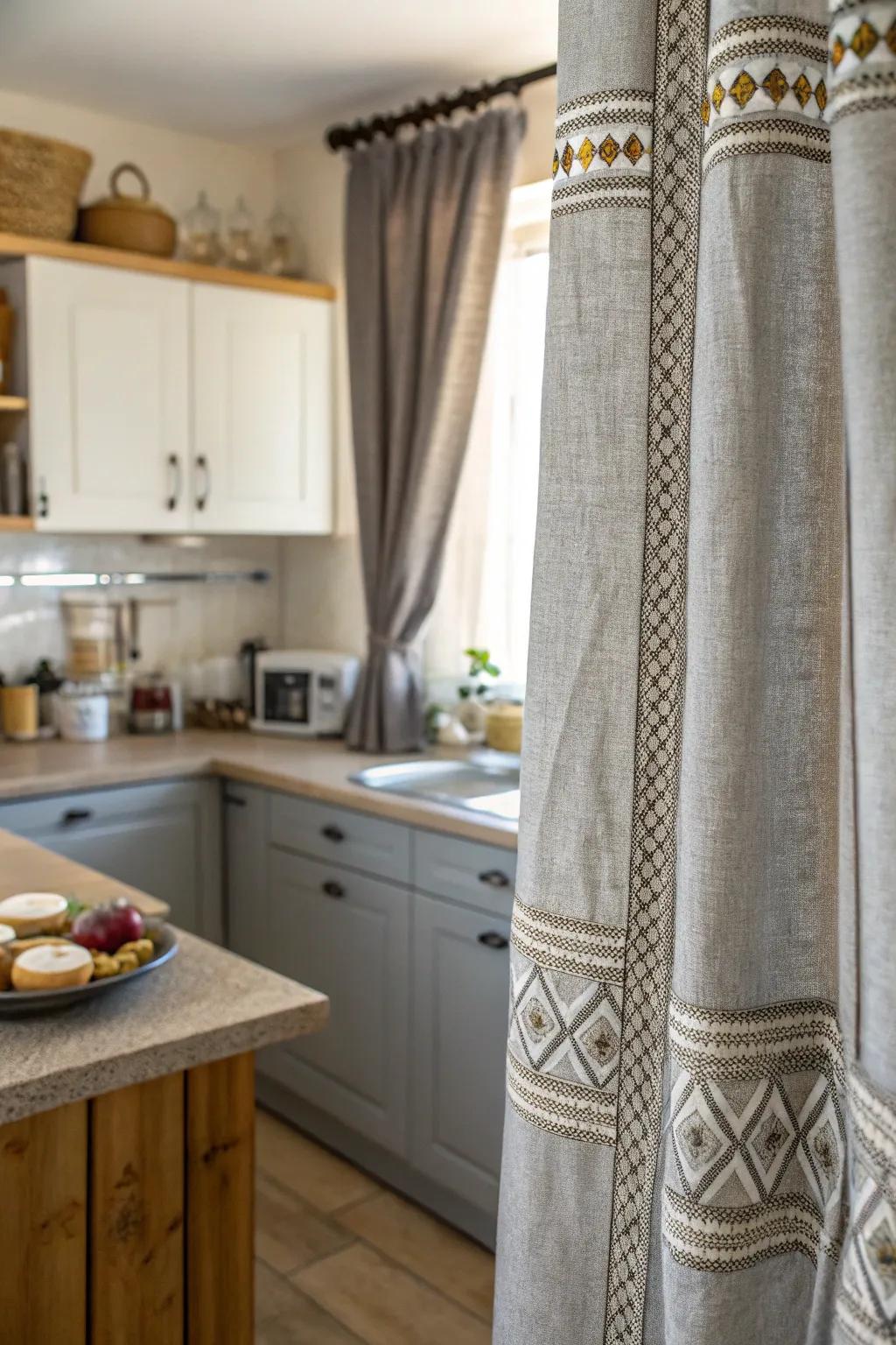 Textured gray drapes infuse a tactile opulence to the culinary space.