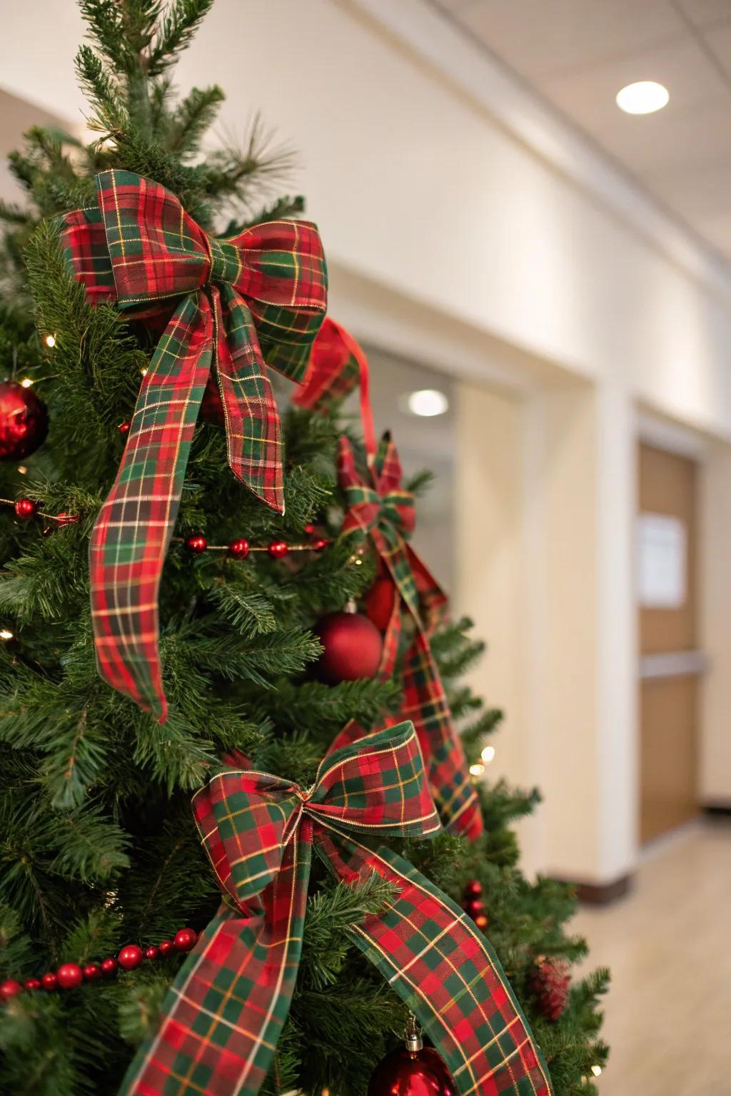 A traditional tartan-themed Christmas tree accentuated with crimson and emerald tones.