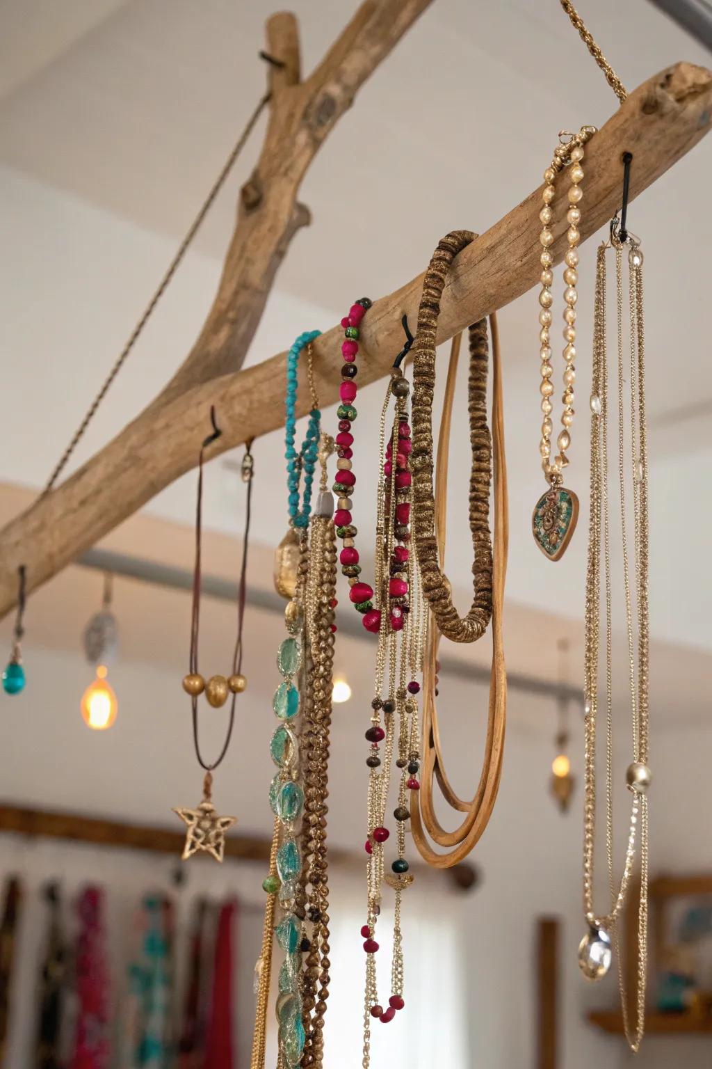 A hanging limb utilized for jewelry display