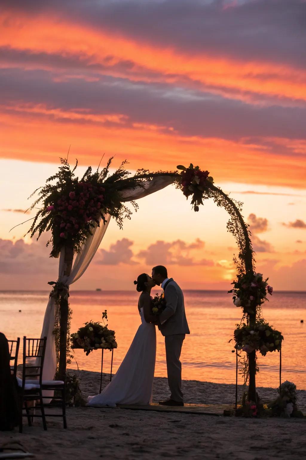 A stunning wedding arch situated against a vibrant sunset backdrop.