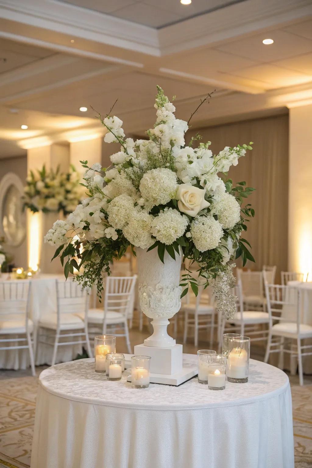 An elegant, monochromatic white floral arrangement, imparting a timeless and refined essence to the wedding decor.
