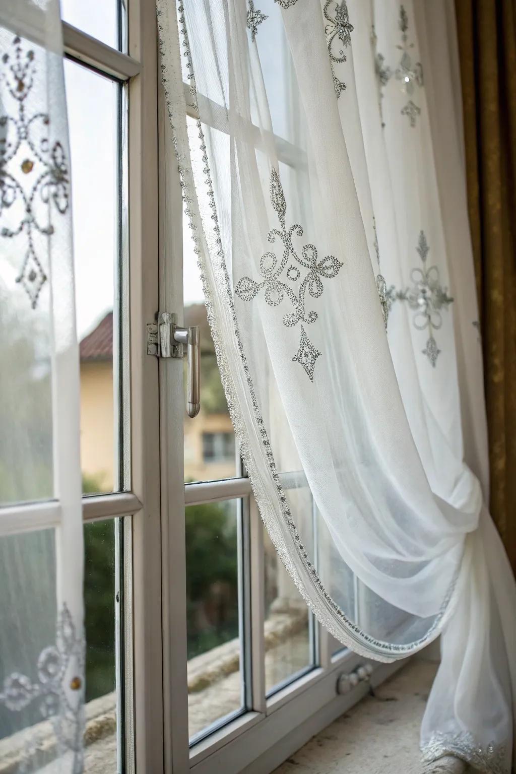 Enhance the brightness of your locale through the incorporation of sheer white curtains and subtle silver detailing.