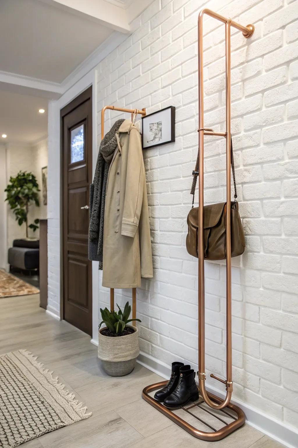 A copper piping coat rack incorporates sophistication and warmth into this chic entrance area.