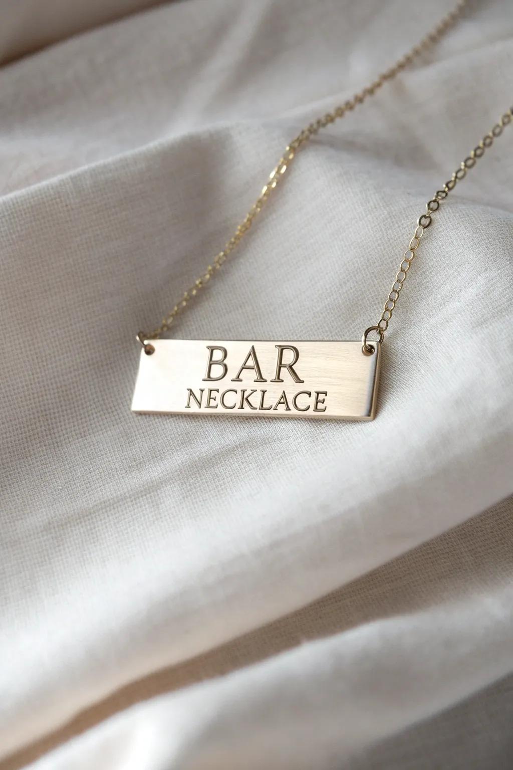 A modern bar pendant with customized inscriptions.