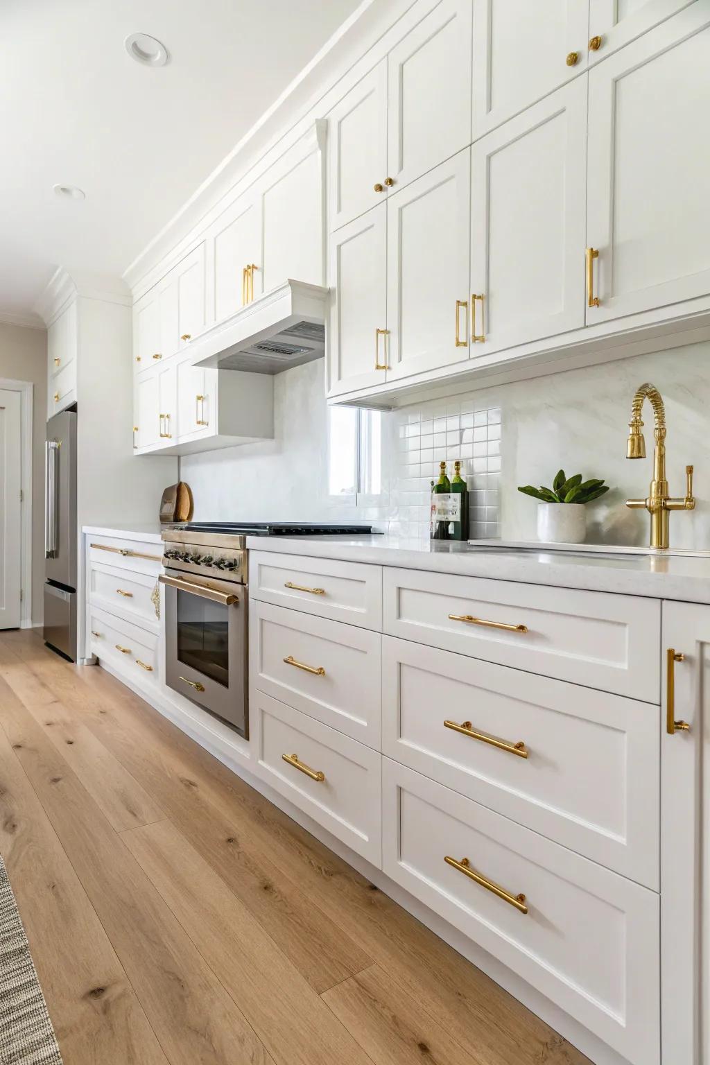 Glamorous gold accents raising an ivory cooking area's beauty.